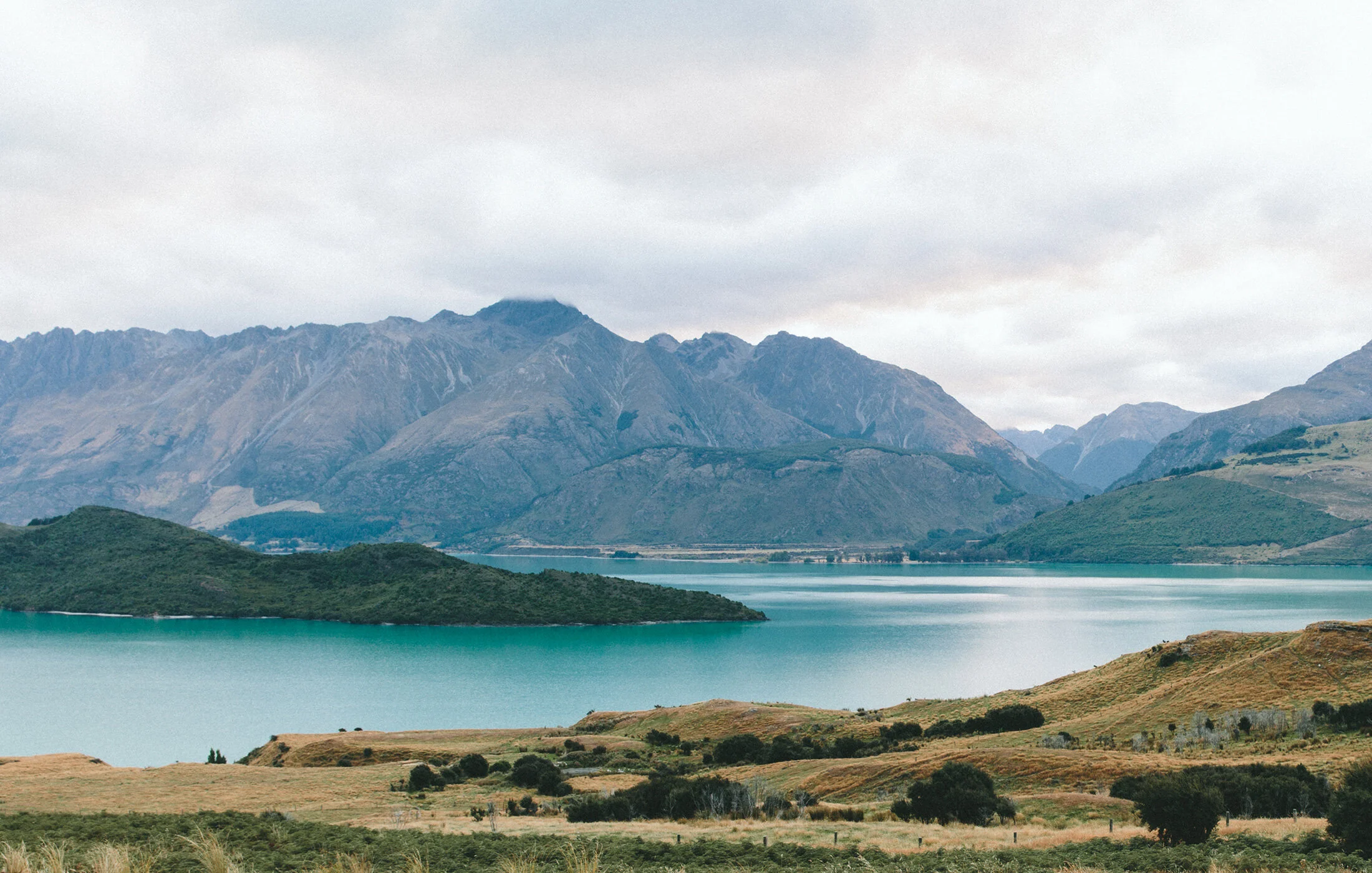 Mountain landscape beside open water